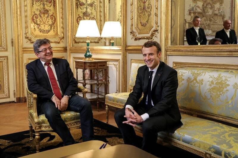 Macron and Melenchon talking in the Elysee Palace